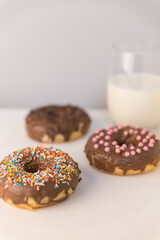 three donuts and a glass of milk