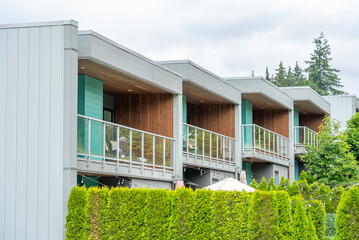 Top of modern apartment building with balcony, trees and beautiful landscape in Vancouver, Canada,...