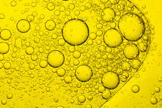 Macro yellow bubble texture close up,Macro microscope yellow bubble texture, Close-up Yellow bubbles and drops oil background . golden Yellow water bubbles, close up golden oil drop for celebration