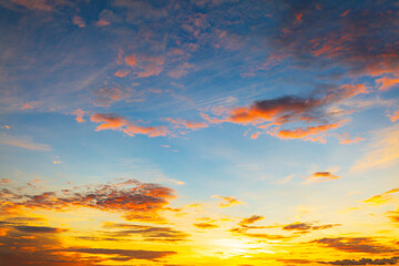 Fototapeta premium Colorful clouds and sky in a beautiful morning,ellow, Pink and red sunlight and Dramatic storm clouds on Twilight sky, Landscape horizon Golden sky nature Summer Background See less.
