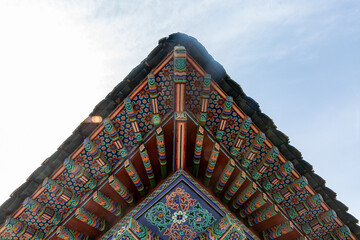 Traditional decorative coloring called dancheong beautifies a Korean temple eave.