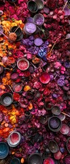 Vibrant Arrangement of Colorful Petals and Paints on Dark Surface