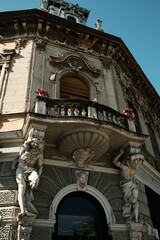 Decorative statues and balcony on the corner of a baroque building in Vrsac, Serbia.