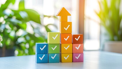 Colorful wooden blocks stacked in an upward trend, marked with checkmarks.  Brightly colored blocks form a staircase, topped with an upward-pointing arrow.  Blurred background of greenery and sunlight