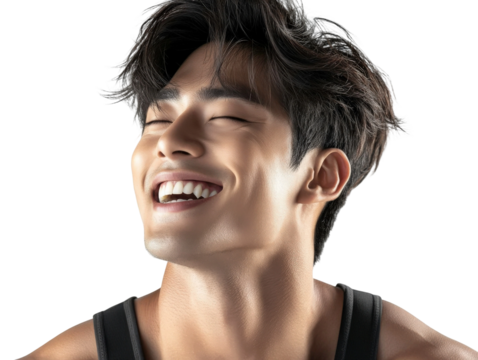 Joyful young man laughing with a bright smile, portrait of happiness and confidence, showing positive emotions and vibrant energy in a studio setting