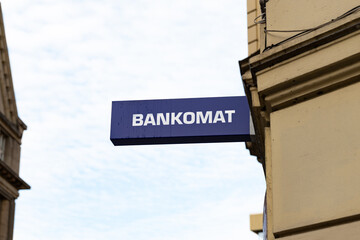 Bankomat sign at a building exterior. Close-up of an ATM signage in Czechia. Place to withdraw cash...