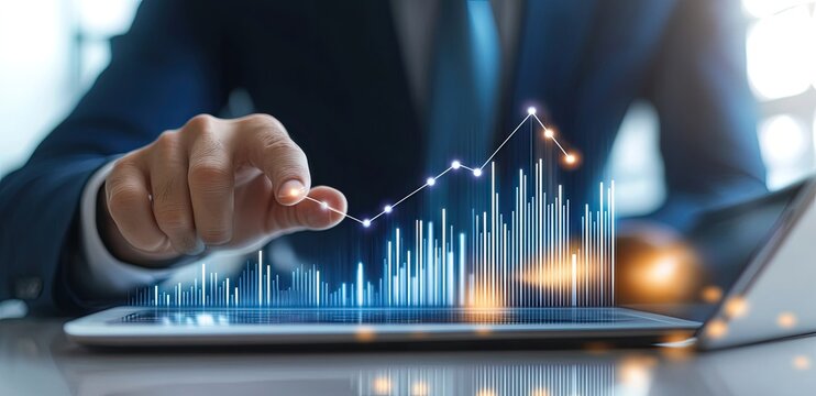 Businessperson interacting with a digital graph on a tablet