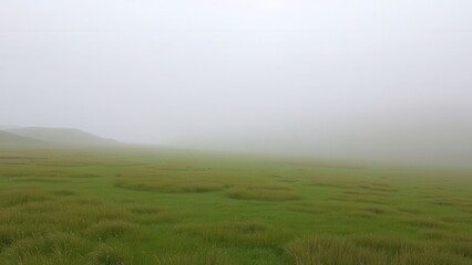 Foggy Green Hills with Lush Grass Fields
