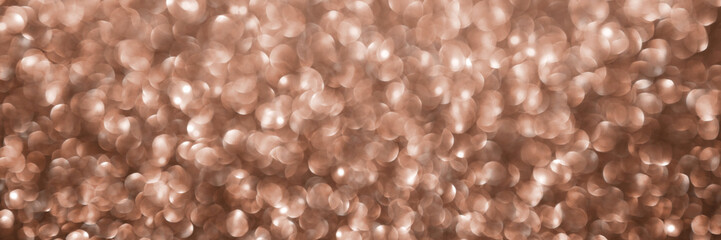 Mocha Mousse, brown sparkling glitter bokeh background banner, abstract defocused texture header. Holiday lights