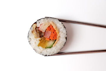Kimbap picked up with chopsticks. Korean food.