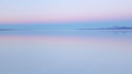 Minimalist Seascape with Pink and Blue Horizon
