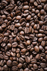 Roasted coffee beans close-up macro shot.Rough textured background pattern.