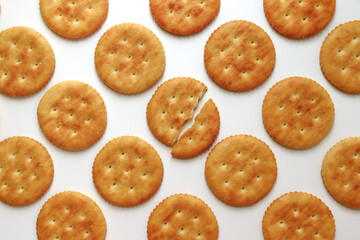 A full cracker. One piece of cracker in the middle is broken.