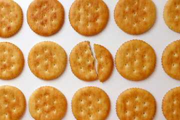 A full cracker. One piece of cracker in the middle is broken.