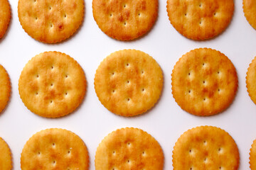 Crackers lined up in a row. Close-up cut.