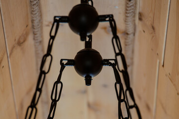 The base of the chandelier is made of black rings