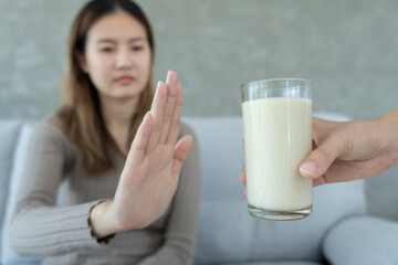 Milk allergens, woman confused milk, runny stuffy sore nose suffer from intolerance allergy trigger...