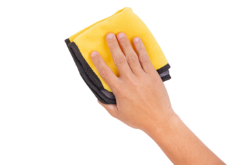 Hand holding a yellow and gray microfiber cloth for cleaning, isolated on white background.