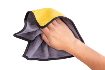 Hand holding a yellow and gray microfiber cloth for cleaning, isolated on white background.  designed for dusting