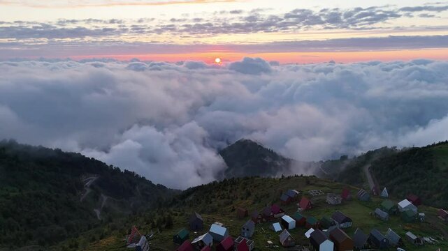 Drone Sunset Over Gomismta Mountains with Clouds Below and Village View in Georgia