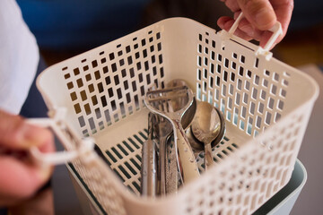 Kitchen Tools and Equipment Arranged Neatly in a Basket for Easy Access and Organization