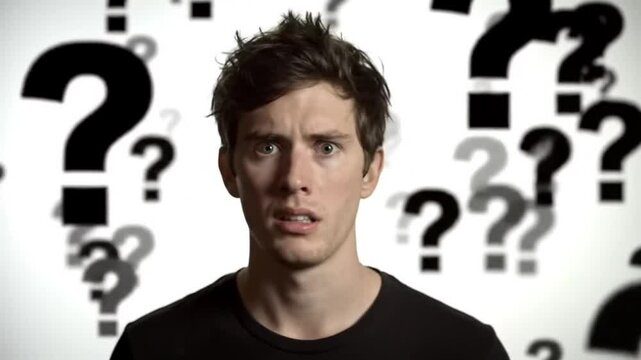 Confused young man with a shocked expression surrounded by floating animated question marks