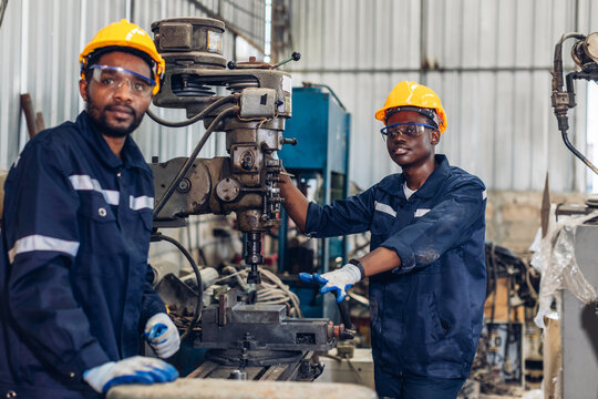 Workers Factory or Engineering work at factory site check up machine or products in site. Foreman or Technician checking Material or Machine on Plant. Heavy industry factory concept. - Powered by Adobe