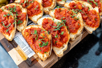 Photo of sliced bread topped with a savory spread. The simple yet appetizing presentation...