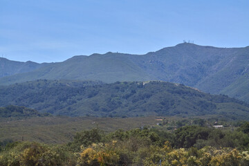 Mountain Valley Overlook with Blue Sky and Distant Hills
