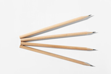 Many graphite pencils on white background, flat lay