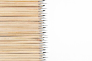 Many graphite pencils on white background, flat lay. Space for text