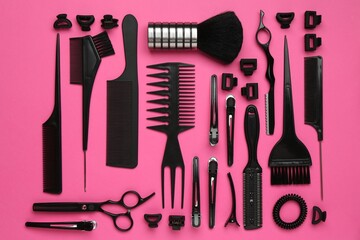 Different hairdresser's tools on pink background, flat lay