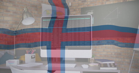Displaying white computer monitor showing lines of code on desk in home office, with chalkboard