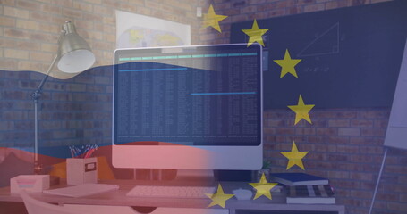 Showing computer monitor displaying code on desk with brick wall, map poster, charts, star overlay
