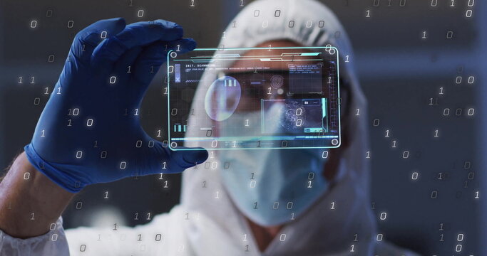 Inspecting man wearing suit, gloves, goggles adjusting digital display in cleanroom, binary data