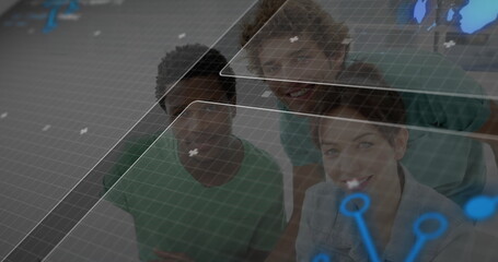 Analyzing team interacting with holographic panels at console with grid overlay, map and blue nodes