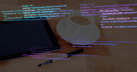 Black tablet sitting on office desk, with mug, stylus, pencil with eraser, code overlay, copy space