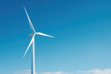 Fototapeta premium lone wind turbine stands tall against clear blue sky embodying clean energy progress with ample copy space