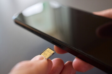 Detailed Process of Installing a SIM Card Utilizing Various Smartphone Components and Accessories
