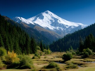 Fototapeta premium Majestic Snow Capped Mountain Peak in a Verdant Valley Landscape