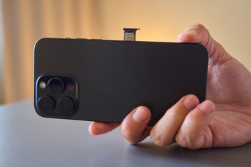 Detailed Process of Installing a SIM Card Utilizing Various Smartphone Components and Accessories