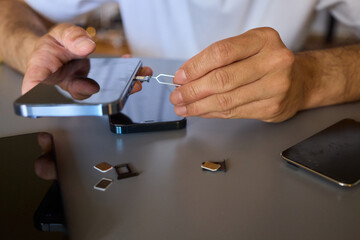 Detailed Process of Installing a SIM Card Utilizing Various Smartphone Components and Accessories