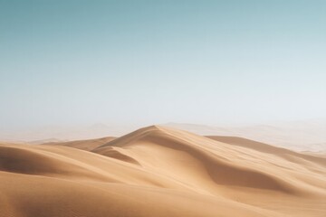 drone-shot aerial view of vast desert landscape with undulating sand dunes