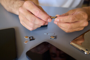 Detailed Process of Installing a SIM Card Utilizing Various Smartphone Components and Accessories