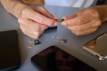 Detailed Process of Installing a SIM Card Utilizing Various Smartphone Components and Accessories