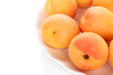 Sweet organic apricots isolated on white background, close-up.