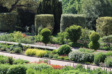 Colourful flower beds and shrubs in a garden in spring