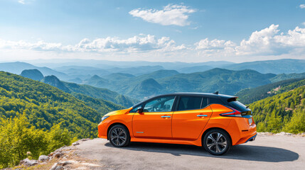 Electric car parked at scenic mountain viewpoint with vibrant orange color and clear blue sky, surrounded by lush green forest and distant hills