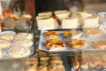 Assorted baked goods displayed in a bakery windowsill