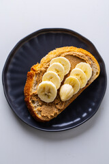 Toast with peanut paste and banana slices